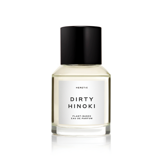 Bottle of Dirty Hinoki Plant Based Perfume by Heretic on white background