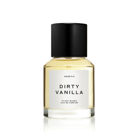 A bottle of 'Dirty Vanilla' perfume by Heretic with a black cap and a label that includes the name and indicates that it is a 'Plant-Based Eau de Parfum'.